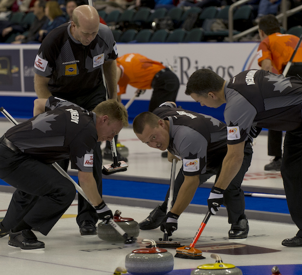 Edmonton skip Kevin Martin, top, directs teammates, from left, Marc Kennedy, Ben Hebert and David Nedohin during Tuesday night's dramatic win over Glenn Howard. (Photo, CCA/Michael Burns)