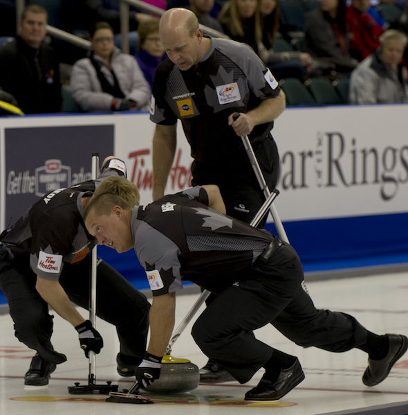 Kevin Martin, top, urges on sweepers Ben Hebert and Marc Kennedy. (Photo, CCA/Michael Burns)