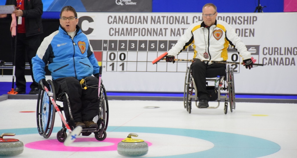 Benoit Lessard (QC) and Dennis Thiessen (MB) in action at the 2015 Canadian Wheelchair Curling Championship in Boucherville, Que. (Photo Morgan Daw)
