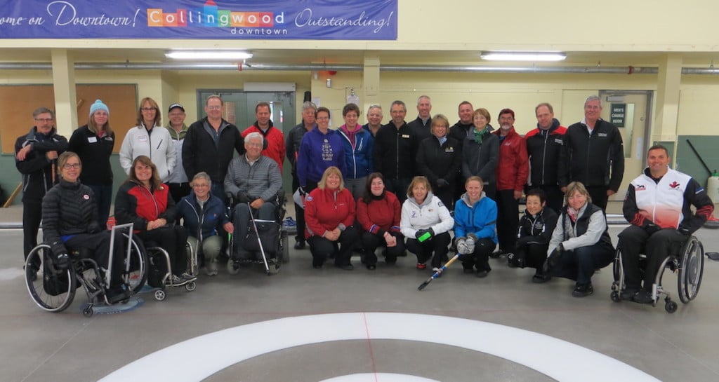 Participants in a wheelchair curling coaching session on the ice at the Collingwood Curling Club with 2014 Paralympic gold medallists Sonja Gaudet (far left) and Mark Ideson (far right) (Photo Curling Canada/Tom Ward)
