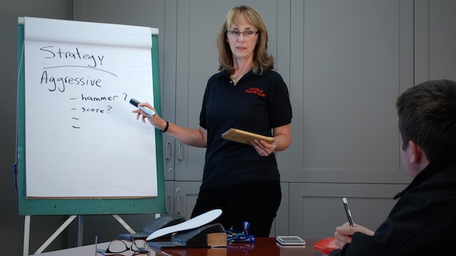 Delores McCallum, Curling Coordinator at the Oakville Curling Club, leads a classroom coaching session during her evaluation as a Competition Development Coach by the National Coaching Certification Program (Photo Michael McCallum)