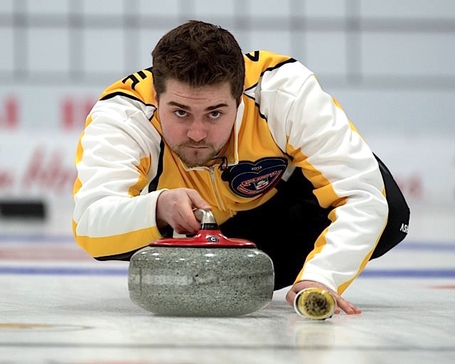 Stratford Ont.Jan 31 2016.Canadian Junior Curling Championship.Manitoba skip Matt Dunstone delivers his stone during his 11-4 victory over Northern Ontario.Dunnstone captures his second Canadian jr. Curling Championship. michael burns photo