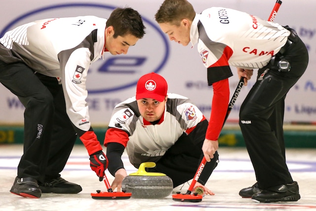 Team Canada skip Matt Dunstone delivers his stone during round robin action on Day 2 of the 2016 World Junior Curling Championships in Taarnby, Denmark (WCF/Richard Gray photo)