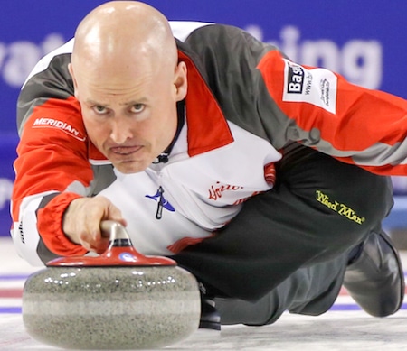 Kevin Koe delivers shot during win over Finland Saturday in Basel, Switzerland. (Photo, World Curling Federation)