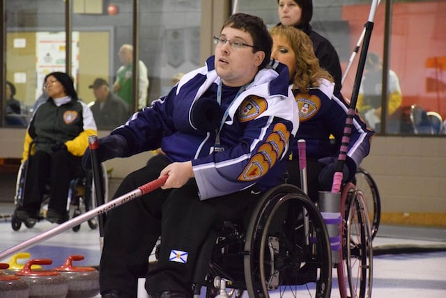Team Nova Scotia second Keith Williams watches his rock move down the ice at the 2016 Canadian Wheelchair Curling Championship in Regina (Curling Canada/Morgan Daw photo)