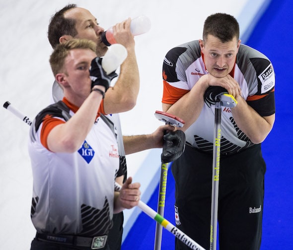 It was a draining, but productive, Sunday for Team Canada's Marc Kennedy, Brent Laing and Ben Hebert. (Photo, World Curling Federation/Céline Stuckli)