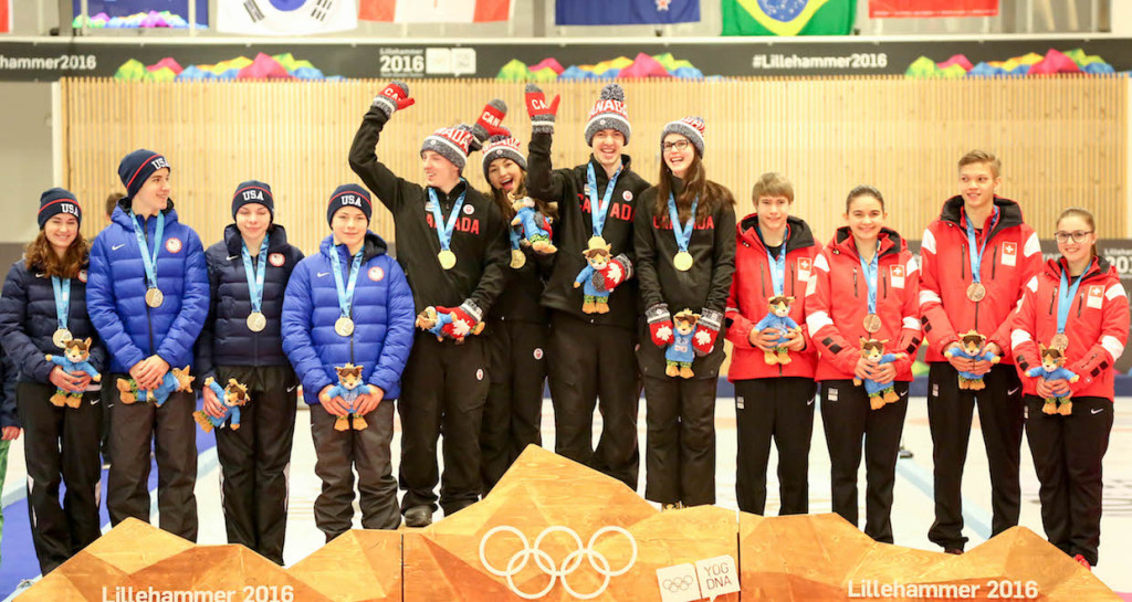 Karlee Burgess with teammates Mary Fay, Tyler Tardi and Sterling Middleton on the podium at the Youth Olympic Games: “Nothing in the world could make me happier.” (WCF/Richard Gray photo)
