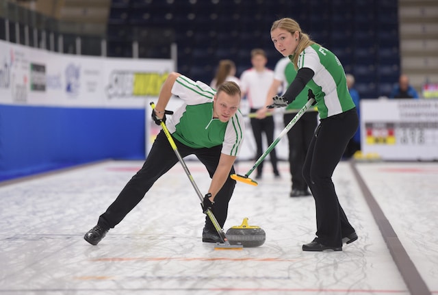 Jacob Hersikorn and Krista Fesser of Saskatchewan guide a rock down the ice during action at the 2017 Canadian Mixed Curling Championship in Yarmouth, N.S. (Curling Canada/Clifton Saulnier photo)
