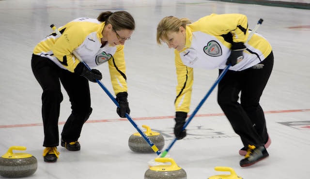 Manitoba second Diana Christensen and lead April Klassen sweep a rock into the house at the 2017 Travelers Curling Club Championship in Kelowna, B.C. (Curling Canada/Jessica Krebs photo)