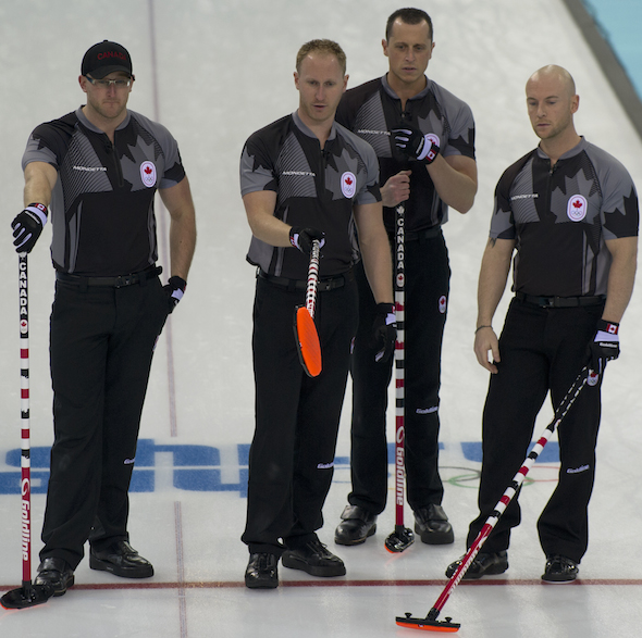 Team Canada, from left, Ryan Harnden, Brad Jacobs, E.J. Harnden and Ryan Fry discuss options in the 10th end. (Photo, CCA/Michael Burns)