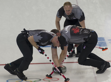 Team Canada skip Brad Jacobs, top, instructs sweepers Ryan Harnden, left, and E.J. Harnden. (Photo, CCA/Michael Burns)
