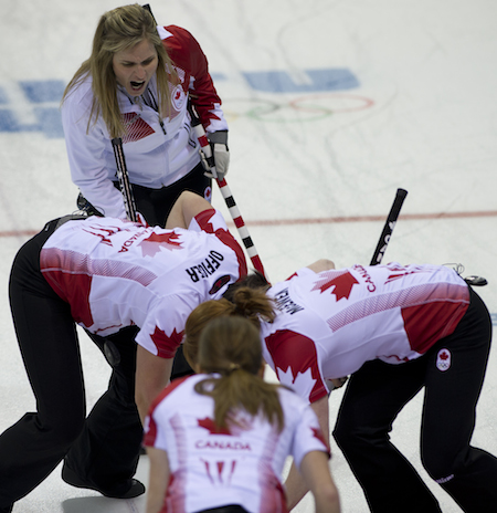 Team Canada works on the game-winning draw by Jennifer Jones on Wednesday.