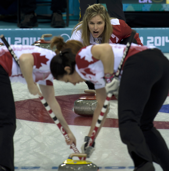 Team Canada skip Jennifer Jones shouts instructions to sweepers Dawn McEwen, left, and Jill Officer. (Photo, CCA/Michael Burns)