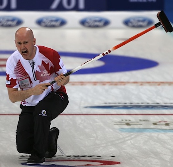 Team Canada skip Kevin Koe guides his sweepers during Sunday's win over China. (Photo, World Curling Federation/Richard Gray)