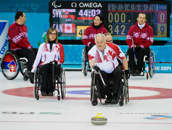 Sochi, RUSSIA - Mar 13 2014 - Sonja Gaudet, and Jim Armstrong as Canada takes on Slovakia in round robin play at the 2014 Paralympic Winter Games in Sochi, Russia.  (Photo: Matthew Murnaghan/Canadian Paralympic Committee)