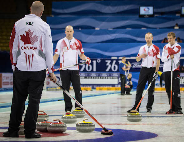Team Canada ponders its situation during Saturday's semifinal loss to Sweden.  (Photo, World Curling Federation / Céline Stucki)