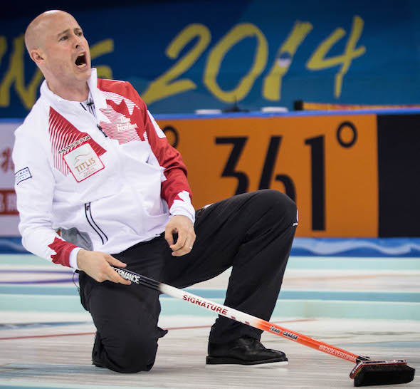 Team Canada skip Kevin Koe instructs his sweepers during Wednesday's loss to Sweden. (Photo, World Curling Federation / Céline Stucki)