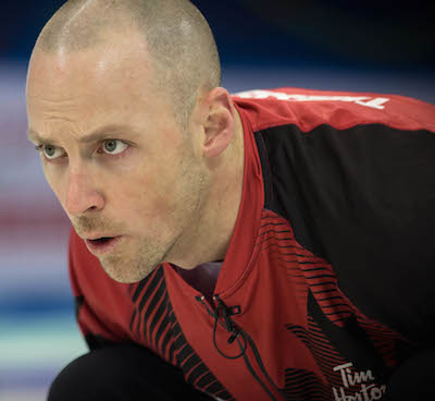 Team Canada's Nolan Thiessen concentrates on his shot during Saturday's loss to Norway. (Photo, World Curling Federation / Céline Stucki)