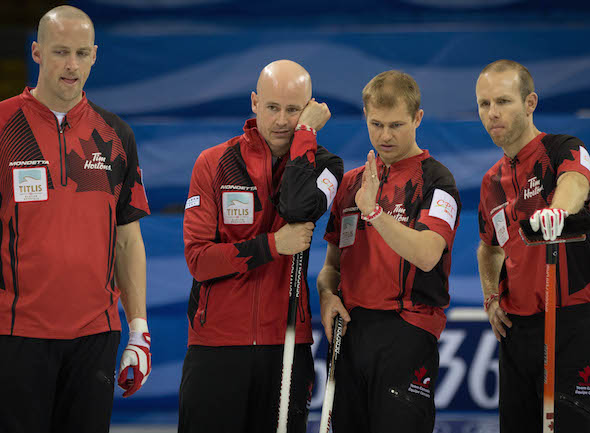 Team Canada ponders its options during Saturday's Page playoff game. (Photo, World Curling Federation / Céline Stucki)