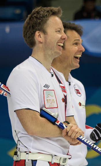 Norway's Thomas Ulsrud, left, and Torger Nergård share a laugh on Saturday. (Photo, World Curling Federation / Céline Stucki)