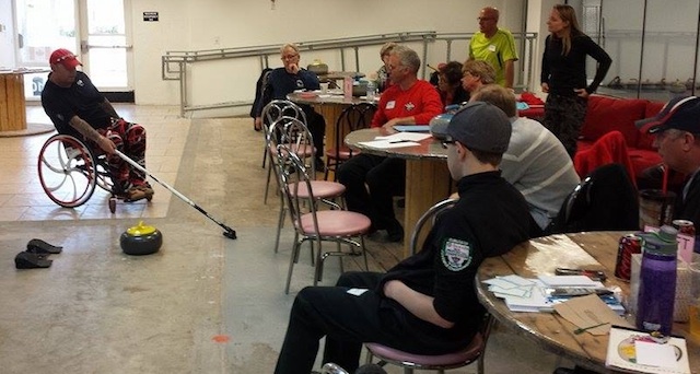 Saskatchewan's Dustin Mikush attends a session on wheelchair curling from US Paralympic skip, Patrick McDonald (Photo courtesy D. Mikush)
